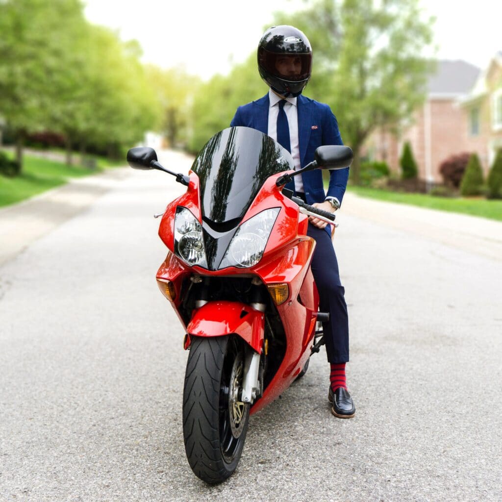 Man in suit on motorcycle